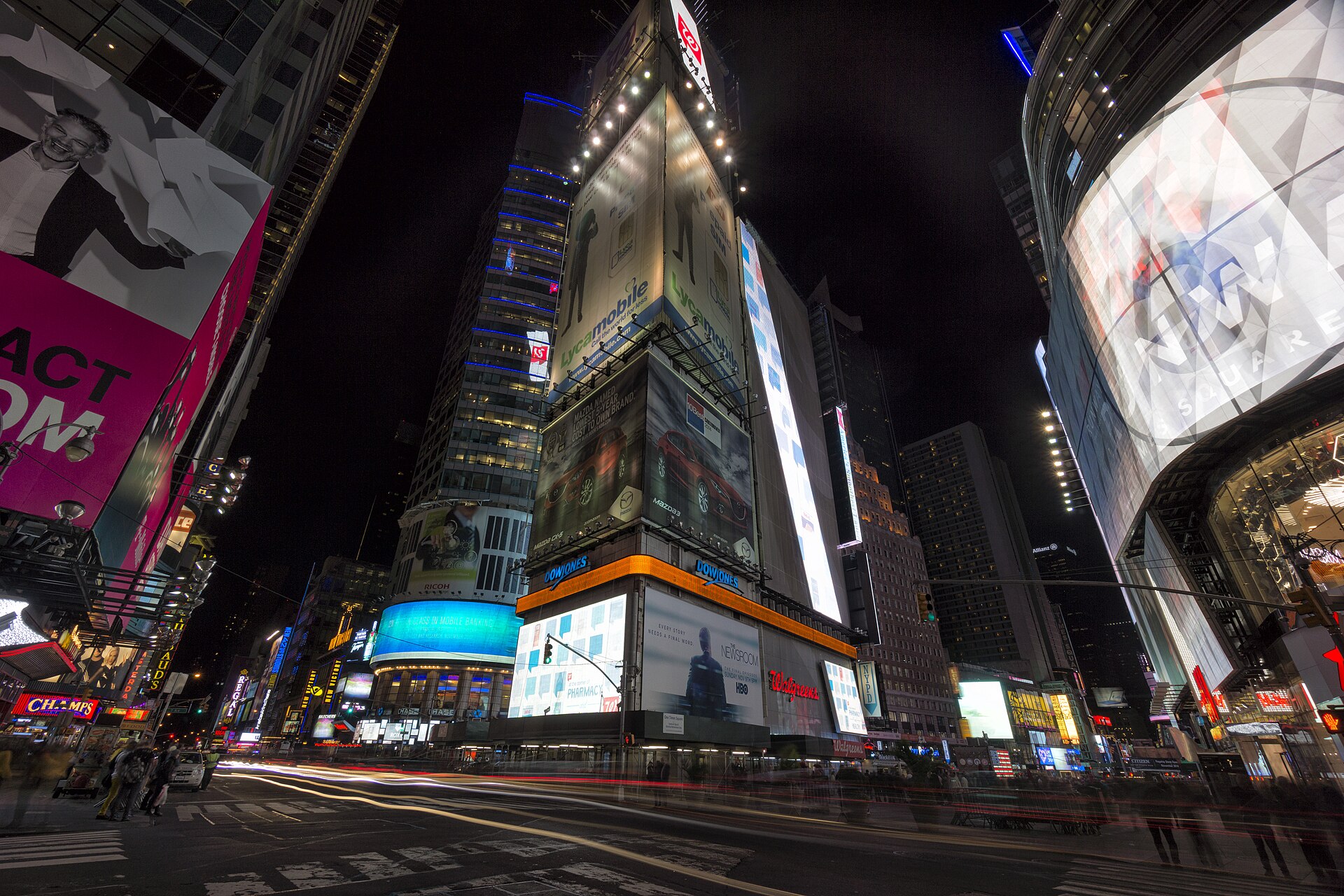 Illuminated billboards and street activity in Times Square, New York at night